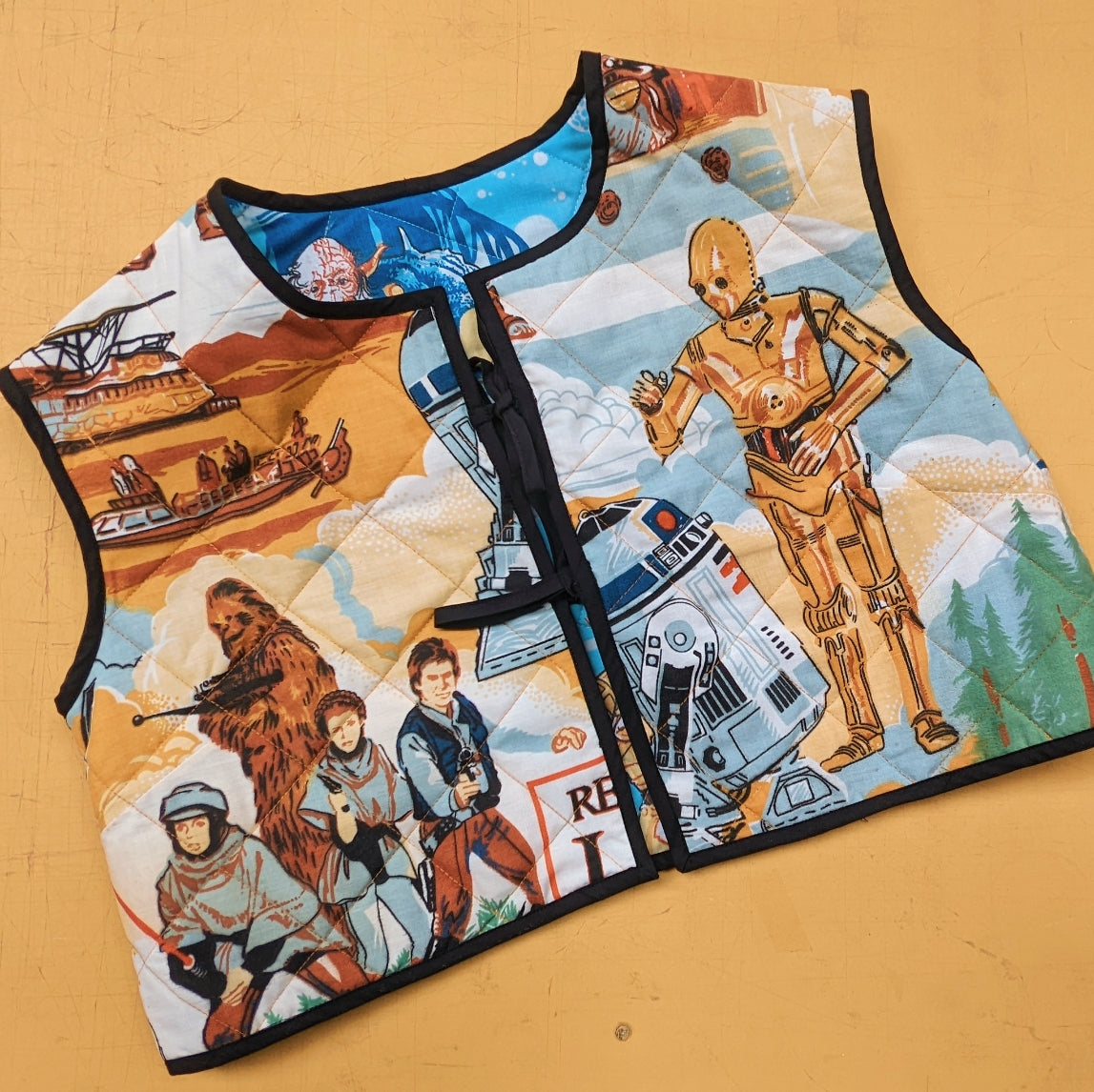 Padded double sided vest made with Reworked Duvet Cover.